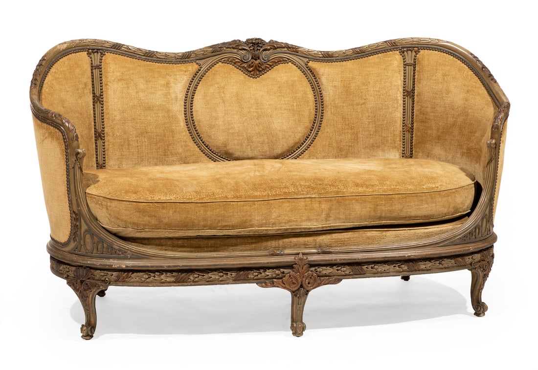 Painted and Parcel Gilt Canapé en Corbeille: Antique Louis XV/XVI-Style Painted and Parcel Gilt Canapé en Corbeille, 19th c., laurel-carved serpentine crest rail with central bouquet, reeded seat rail, scrolled feet, h. 39 1/4 in., w. 69 in