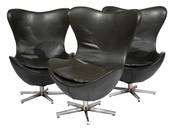 Three Contemporary Leather and Chrome Egg Chairs