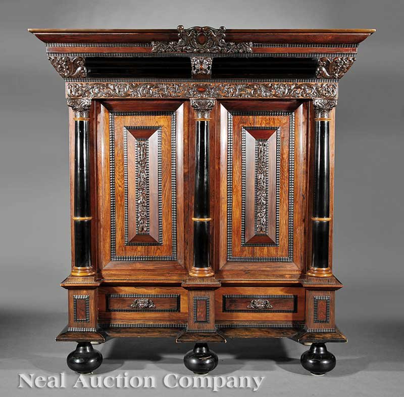 Carved, Ebonized Rosewood Cupboard or 'Kussenkast: An Antique Baroque-Style Carved and Ebonized Rosewood Cupboard or 'Kussenkast', probably late 19th c., of 17th c. Dutch inspiration, flared cornice centered by cabochon crest with birds and scrolled a