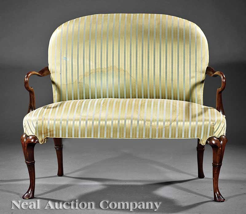 A Dutch Carved Walnut Settee: A Dutch Carved Walnut Settee, 19th c., padded back and feet, shepherd's crook arms, cabriole legs ending in pad feet, height 37 in., width 43 1/2 in., depth 20 1/2 in