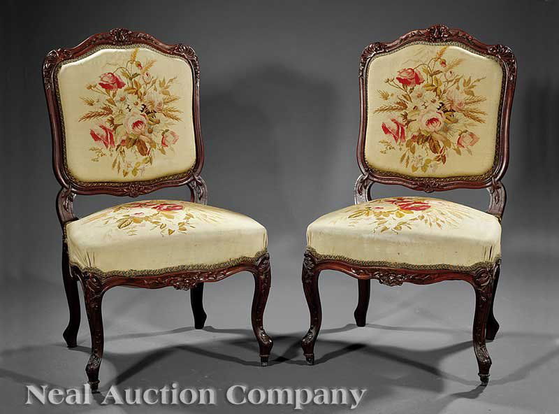 A Pair of Louis Philippe Carved Rosewood Chaises: A Fine Pair of Louis Philippe Carved Rosewood Chaises, mid-19th c., shaped foliate crests, molded foliate stiles, serpentine seat rails, acanthus and anthemion carved cabriole legs, casters, retaining