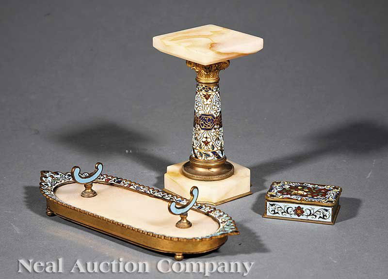 Three Continental Champleve Enamel Desk Accessori: A Group of Three Continental Champleve Enamel and Bronze Desk Accessories, late 19th c., including an alabaster pen tray, a lidded pin box, and a small alabaster pedestal, tray height 1 3/4 in., width