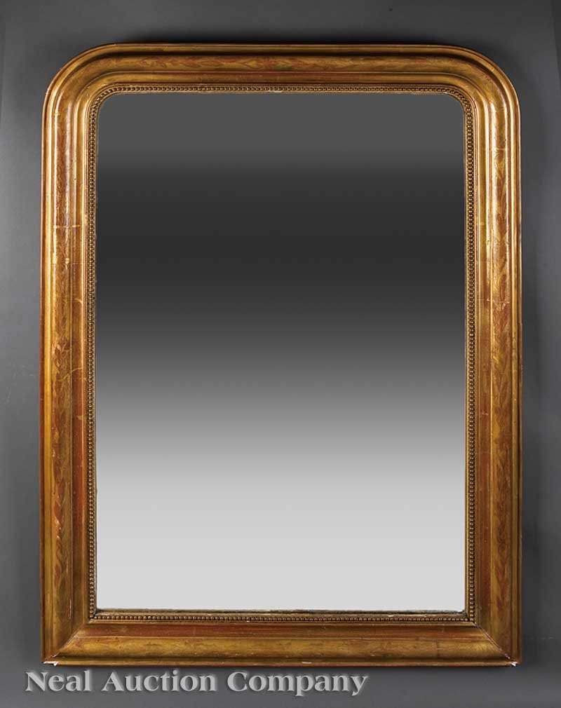 A French Giltwood Overmantel Mirror: A French Giltwood Overmantel Mirror, 19th c., with floral incised decoration and beadwork, height 54 in., width 37 1/2 in