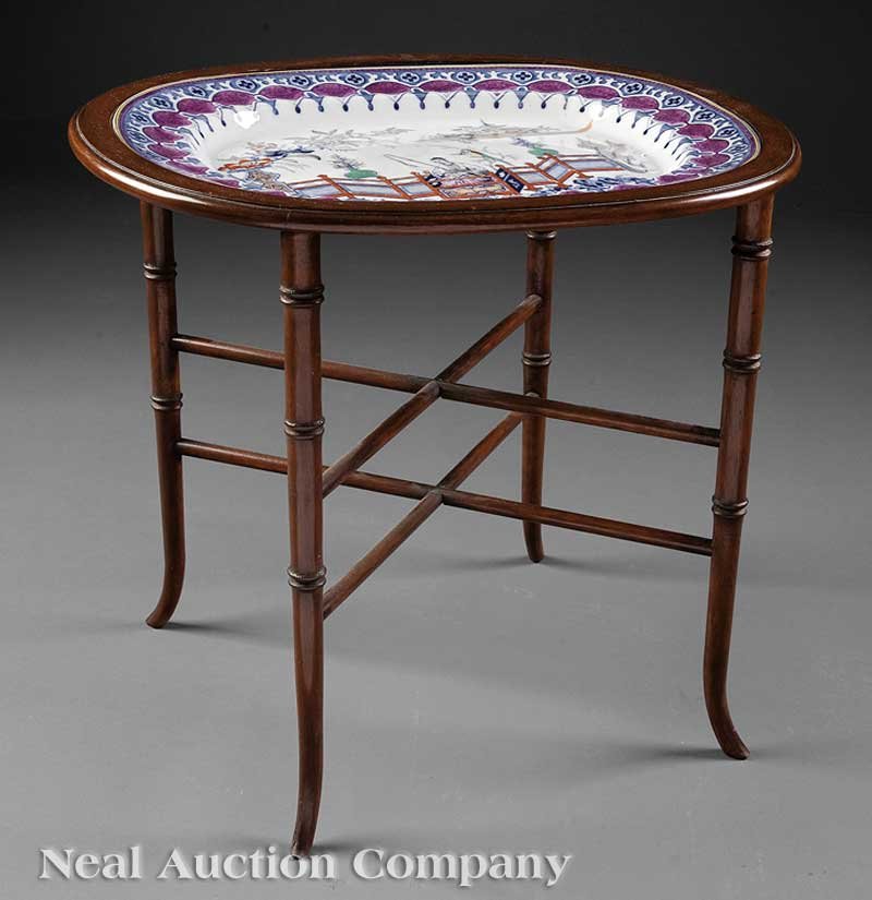 An Antique English Ironstone Platter: An Antique English Ironstone Platter, 19th c., Imperial Stone China, "Penang" pattern, now mounted in a bamboo-turned mahogany stand as a side table, platter length 20 3/4 in., overall height 21 in., 
