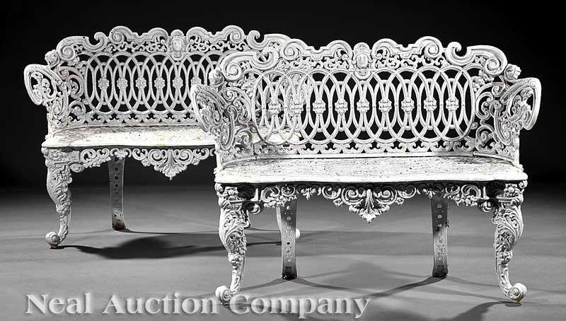 A Pair of American Cast Iron Garden Benches: A Pair of American Cast Iron Garden Benches, backs with intertwined rosettes, scrolled arms, serpentine pierced seats, acanthine cabriole legs, height 32 1/2 in., width 44 in., depth 14 1/2 in