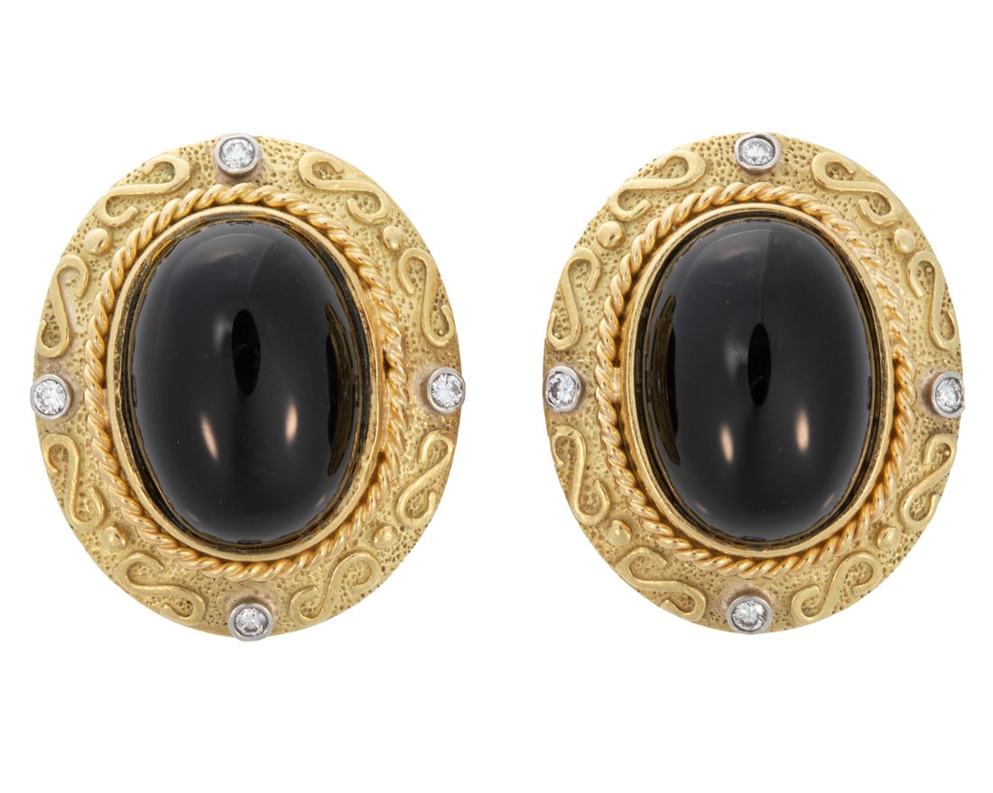18 kt. Yellow Gold, Onyx and Diamond Earrings: , marked, central bezel set oval cabochon onyx, scrollwork bezels mounted with 8 round diamonds, clip backings, l. 1 in.; 20.14 dwts.Please note: Payment for all jewelry must be made by cash, check or