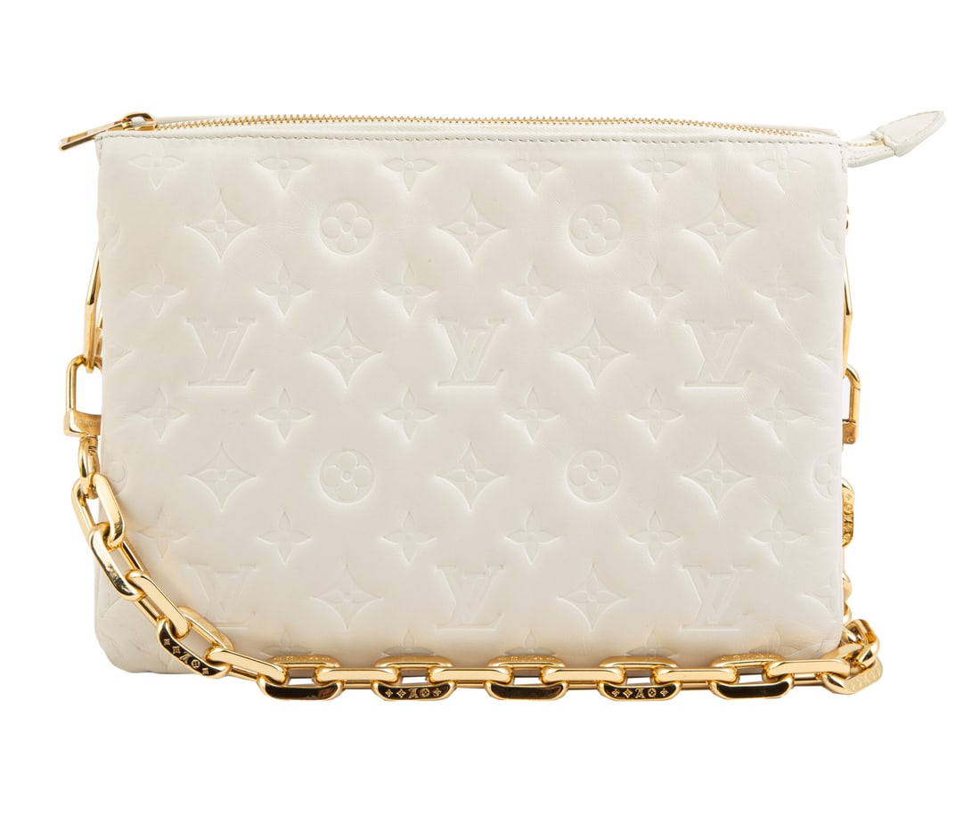 Louis Vuitton Coussin PM Handbag in Cream Monogram-Embossed Puff Lambskin Leather , h. 8 in., w. 10: , gold-tone hardware, calfskin leather trim, cowhide leather lining, 3 interior compartments, h. 8 in., w. 10 1/4 in., d. 4 3/4 in.; removable chain strap, drop h. 10 1/2 in.; Condition: Excellent.