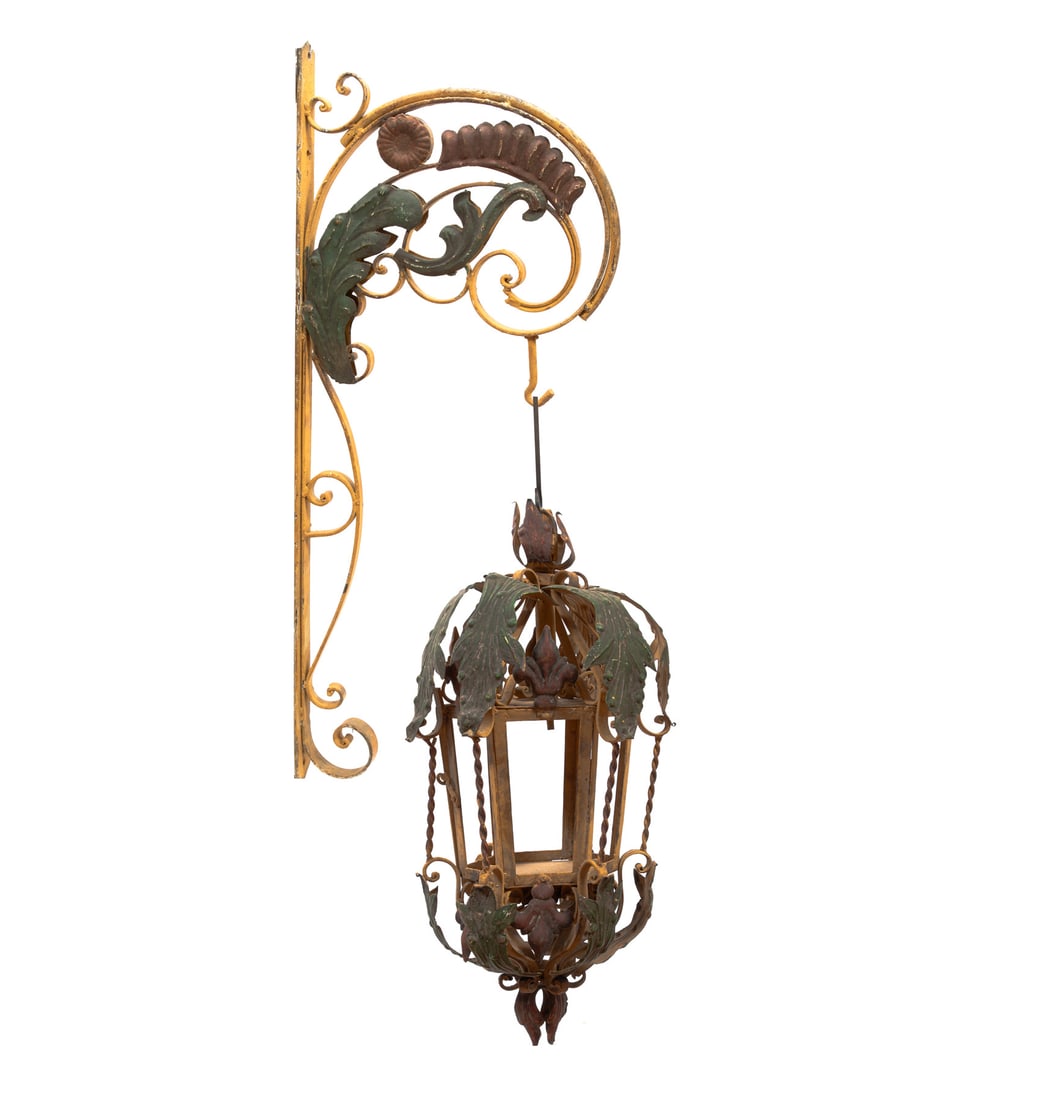 Pair of Italian Polychromed Iron and Tole Lanterns h. 38 in., w. 14 in., d. 20 in.: Pair of Italian Polychromed Iron and Tole Lanterns , scroll bracket, hexagonal-form lantern, h. 38 in., w. 14 in., d. 20 in. h. 38 in., w. 14 in., d. 20 in.