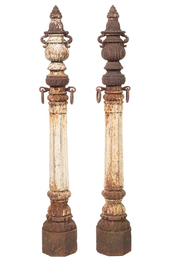 Pair of Antique American Cast-Iron Hitching Posts h. 49 1/2 in.: Pair of Antique American Cast-Iron Hitching Posts , foliate designs, fluted central column, flanked by rings, h. 49 1/2 in. h. 49 1/2 in.