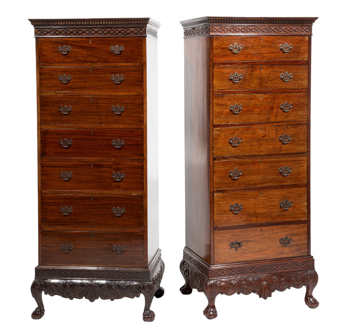 Pair of Chippendale-Style Caved Mahogany Tall Chests on Stand h. 69 in., w. 28 1/2 in., d. 19 in.: Pair of Chippendale-Style Caved Mahogany Tall Chests on Stand , late 19th /early 20th c., dental molded cornice, blind carved fretwork, seven drawers, scrolled center shell apron, ball and claw feet, 