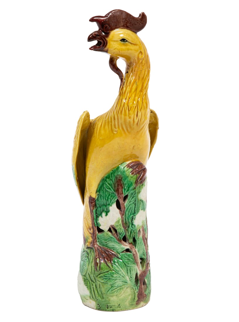 Chinese Glazed Porcelain Figure of a Phoenix 10 x 2 3/4 in. (25.4 x 7 cm.): Chinese Glazed Porcelain Figure of a Phoenix , modeled perched on branches, base with impressed factory mark, h. 10 1/8 in. 10 x 2 3/4 in. (25.4 x 7 cm.) Provenance: Estate of Sybil M. Favrot, New Orl