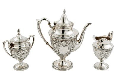 American Sterling Silver Repousse Three-Piece Tea Service, Teapot h. 10 3/8 in.; total weight 36.45