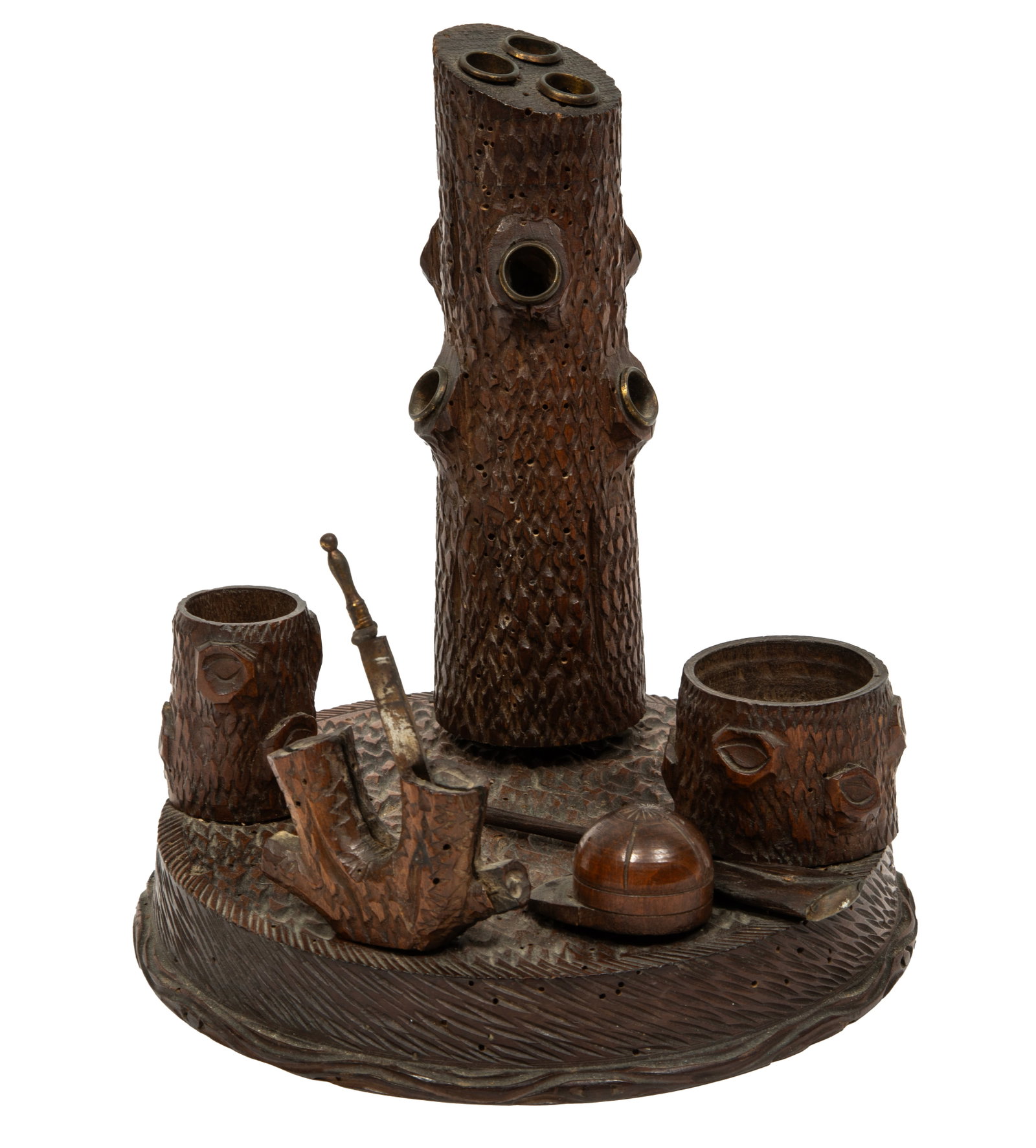 Black Forest Carved Walnut Smoke Stand: Black Forest Carved Walnut Smoke Stand c. 1900, various holders, one log features a blade-form cutter, also a hunting cap and rifle 8 1/2 x 7 in. (21.6 x 17.8 cm.)