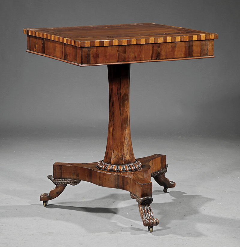 Regency Inlaid Rosewood Games Table: A Regency Inlaid Rosewood Games Table, c. 1810, rectangular sliding reversible top, backgammon interior, chamfered stem, incurvate plinth on paw feet, casters, height 30 in., width 24 in., depth 22 in