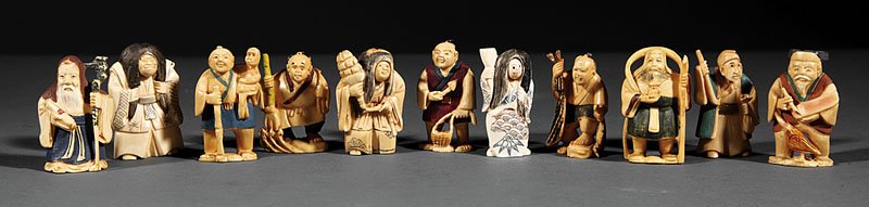 Eleven Japanese Carved Ivory Netsuke: A Group of Eleven Japanese Carved Ivory Netsuke, comprising 8 painted figures of peasants and sages, and 3 figures with revolving faces, largest height 2 in