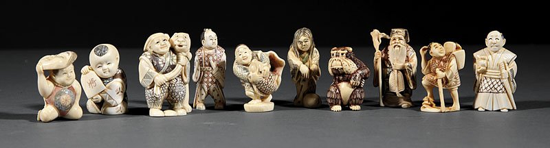 Ten Japanese Carved Ivory Netsuke: A Group of Ten Japanese Carved Ivory Netsuke, comprising stained and colored figures of immortals, demons and boys, largest height 2 in