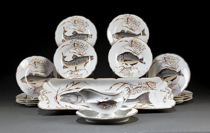 Paris Porcelain Fish Service: A Paris Porcelain Fish Service, including a shaped rectangular platter, height 2 1/8 in., width 22 3/4 in., depth 8 1/4 in., and 12 fish plates, diameter 8 3/8 in, each decoarted with fish swimming am