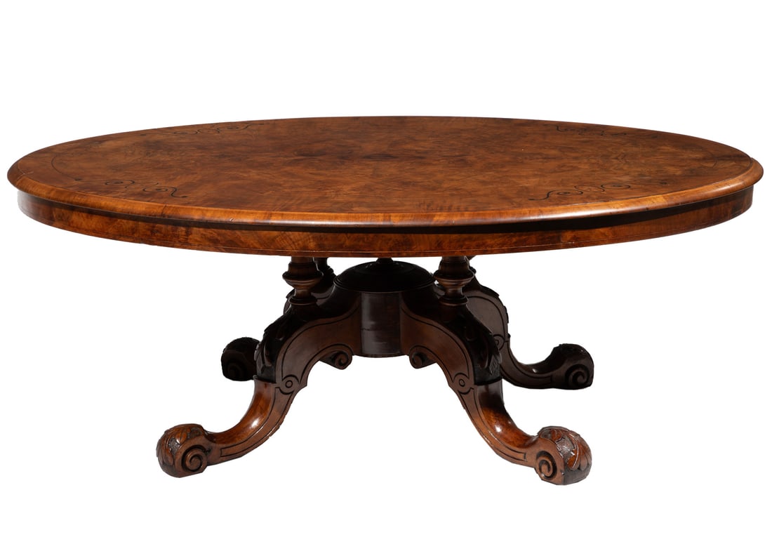 William IV Inlaid Mahogany Loo Table: William IV Inlaid Mahogany Loo Table, 19th c., molded oval top, turned baluster supports, outscrolled legs, scrolled toes,20 x 53 x 40 1/4 in. (50.8 x 134.6 x 102.2 cm.) Ida Manheim Antiques, 409 Roya