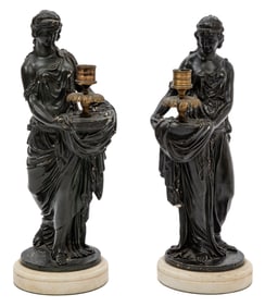Pair of Neoclassical Ebonized and Gilt Metal Figural Candle Holders