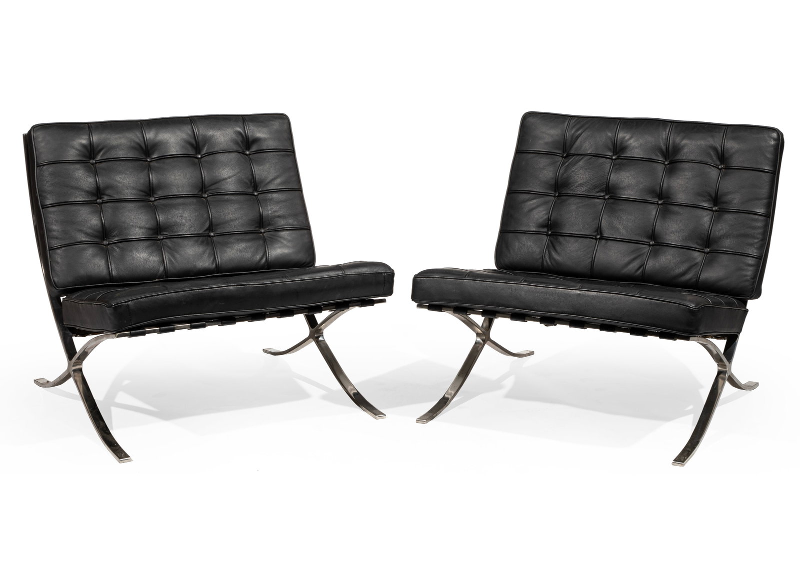 Pair of Mies van der Rohe-Style Barcelona Chairs: Pair of Mies van der Rohe-Style Barcelona Chairs leather and polished chromed steel 30 x 30 x 32 in. (76.2 x 76.2 x 81.3 cm.)