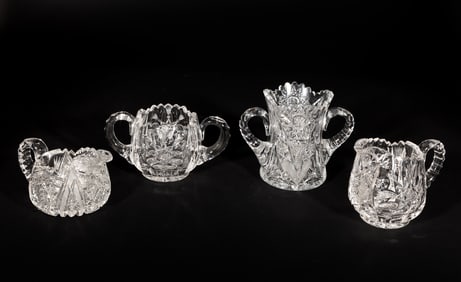 Four Small Cut Glass Pitchers