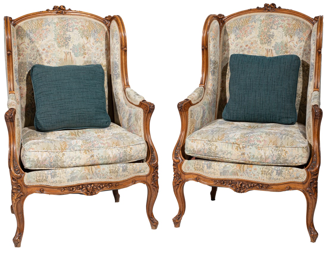 Pair of Louis XV-Style Carved Walnut Berg?res a Oreilles: Pair of Louis XV-Style Carved Walnut Berg?res a Oreilles, late 19th/early 20th c., molded arched crest and stiles, padded arms, serpentine seat rail, cabriole legs,Provenance: French Antique Shop, New