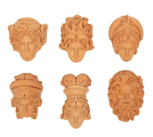 Six Decorative Diminutive Terracotta Heads