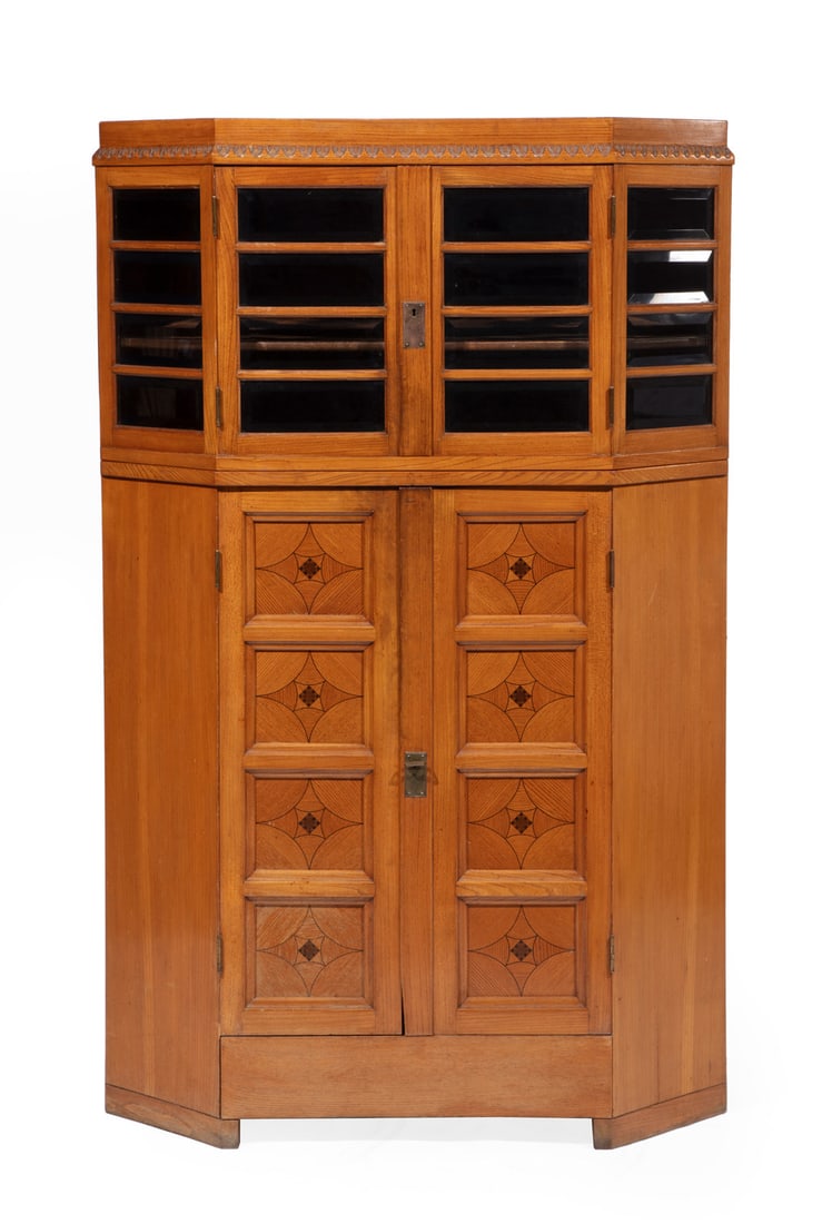 Jugendstil Inlaid Oak Vitrine Cabinet: Jugendstil Inlaid Oak Vitrine Cabinetc. 1910, attributed to Bruno Paul, ebony-inlay, double-trapezoidal case, upper case with beveled glass doors, paneled lower case, conforming baseh. 62 in., w. 39 1