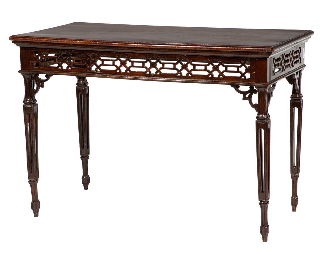 Chippendale-Style Carved Mahogany Tea Table: Chippendale-Style Carved Mahogany Tea Table19th c., molded top, pierced carved fretwork frieze, square tapered pierced carved legs27 1/2 x 40 x 20 1/2 in. (69.9 x 101.6 x 52.1 cm.) Provenance: Ida Man