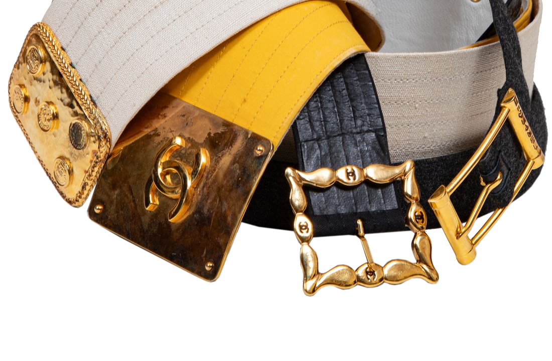 Four Vintage Chanel Belts: Four Vintage Chanel Beltsmade in France, incl. yellow fabric belt with gold-tone metal logo buckle, labeled "70/28", l. 32 in.; beige linen belt with gold-tone metal logo buckle, l. 33 1/4 in.; gray w
