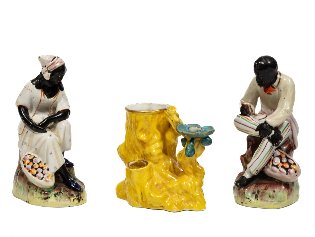 Pair of Staffordshire Figures of Uncle Tom and Aunt Chloe: Pair of Staffordshire Figures of Uncle Tom and Aunt Chloe,mid-19th c., from Harriet Beecher Stowe's Uncle Tom's Cabin; together with a Royal Worcester spill vase, also mid-19th c., figures h. 6 1/4 in
