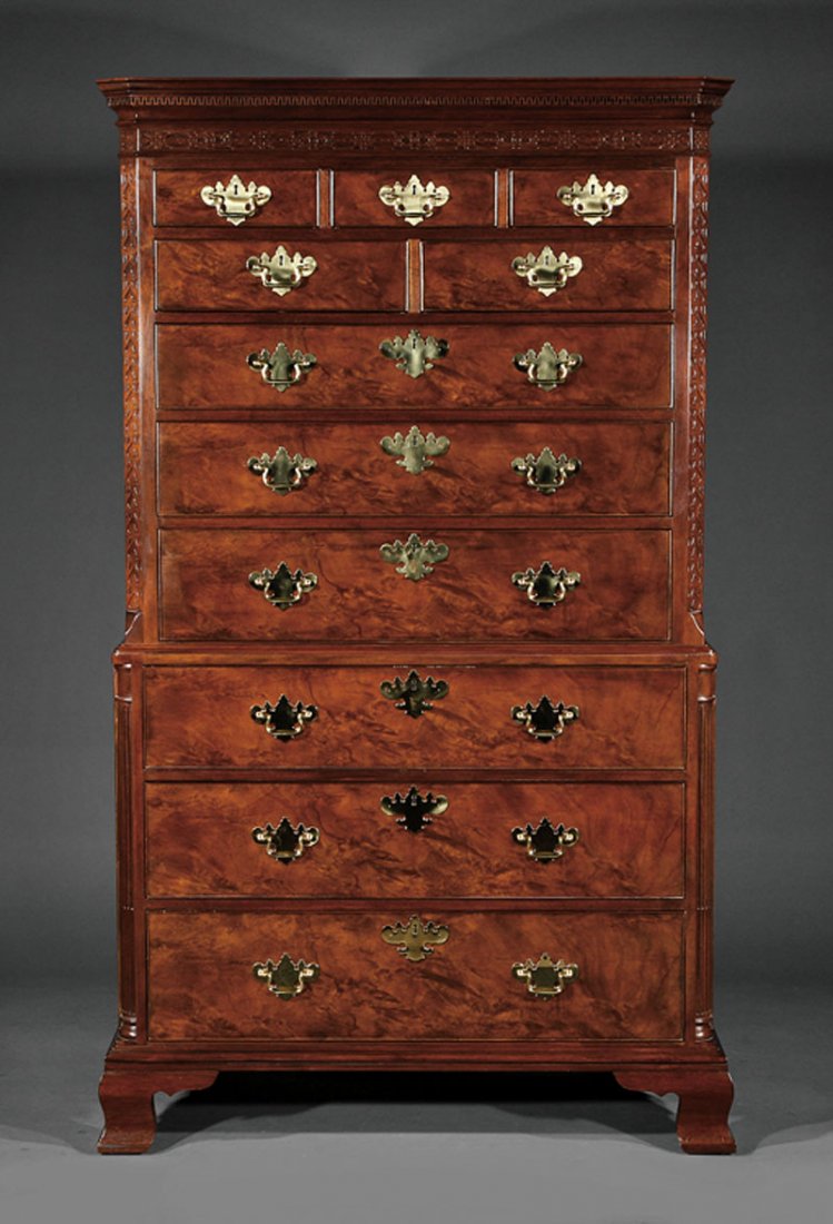 A Georgian-Style Carved Mahogany Chest-on-Chest: A Georgian-Style Carved Mahogany Chest-on-Chest, 20th c., Baker Furniture "Historic Charleston Reproductions", labeled, upper case with dentil molded cornice, blind fretwork frieze, configuration of f