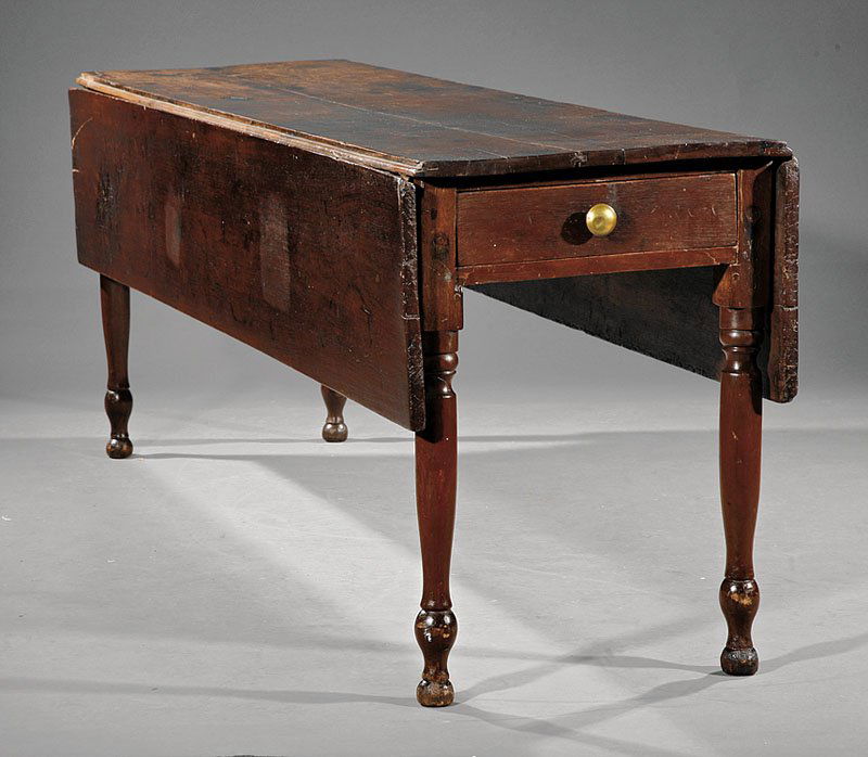 A Southern Carved Walnut Harvest Table: A Southern Carved Walnut Harvest Table, early 19th c., Valley of Virginia, drop-leaf top, deep drawer at one end, turned legs ending in ball feet, height 29 1/2 in., length 84 in., width 22 1/2 in