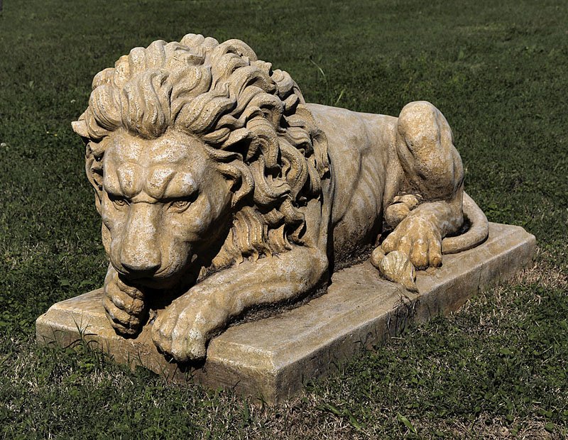 A Pair of Decorative Recumbent Lions: A Pair of Decorative Recumbent Lions, 20th c,. composition with "stone" surface, based on the well-known pair by Antonio Canova (Italian, 1757-1822), height 25 in., width 23 in., depth 46 in