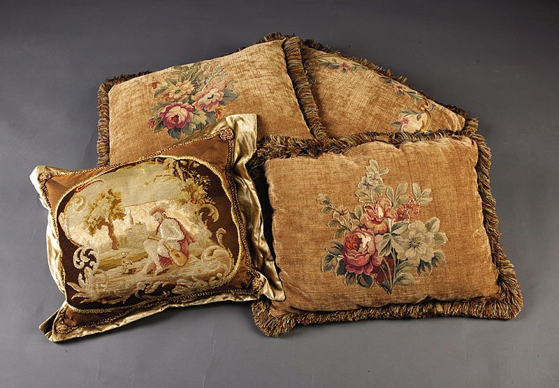 A Group of Eight Tapestry Pillows: A Group of Eight Antique Tapestry Pillows, 6 with floral Aubusson appliques on modern deep gold fabric with multicolored fringe, height 20 1/2 in., width 26 in.; one embroidered with lute player and d