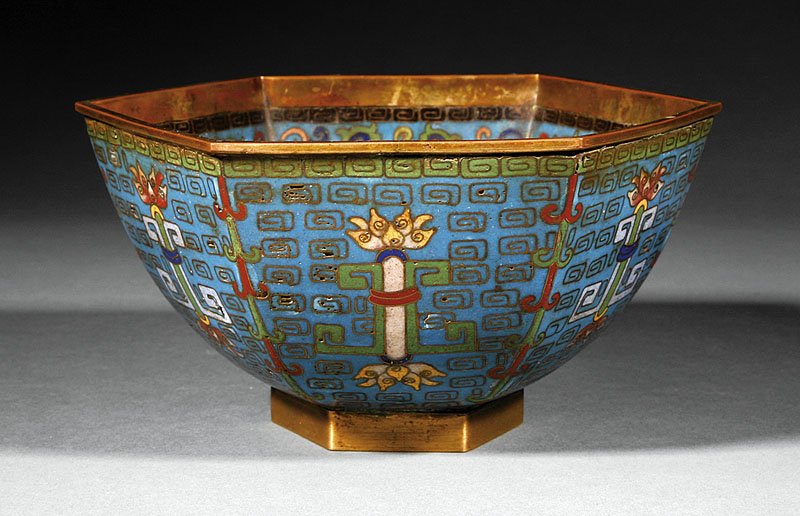 A Chinese Cloisonne Enamel Hexagonal Bowl: A Chinese Cloisonne Enamel Hexagonal Bowl, 19th c., the interior well decorated with two bats beneath radiating floral and antique panels on the walls, the exterior with lotus batons on a geometric gr