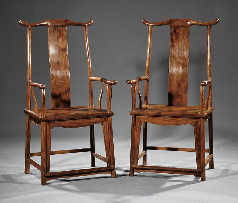 Chinese Huanghuali or Huali Wood Yoke Back Armchairs: A Pair of Chinese Huanghuali or Huali Wood Yoke Back Armchairs, Guanmaoyi, Qing Dynasty (1644-1911), each with elegantly curved "official's hat" top rail supported on a curved backsplat and turned bac