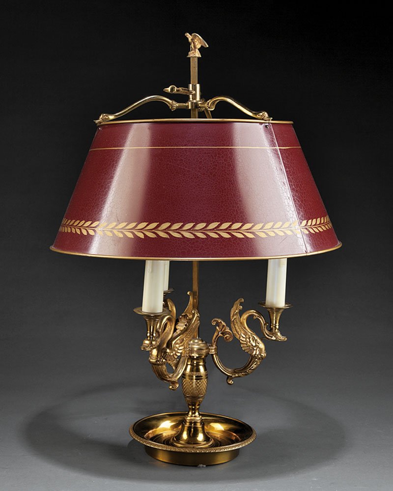 An Empire-Style Tole Peinte Bouillotte Lamp: An Empire-Style Gilt Bronze and Tole Peinte Bouillotte Lamp, vasiform standard issuing three swan-form arms, adjustable shade, eagle finial, molded base, height 23 5/8 in., diameter 16 1/4 in