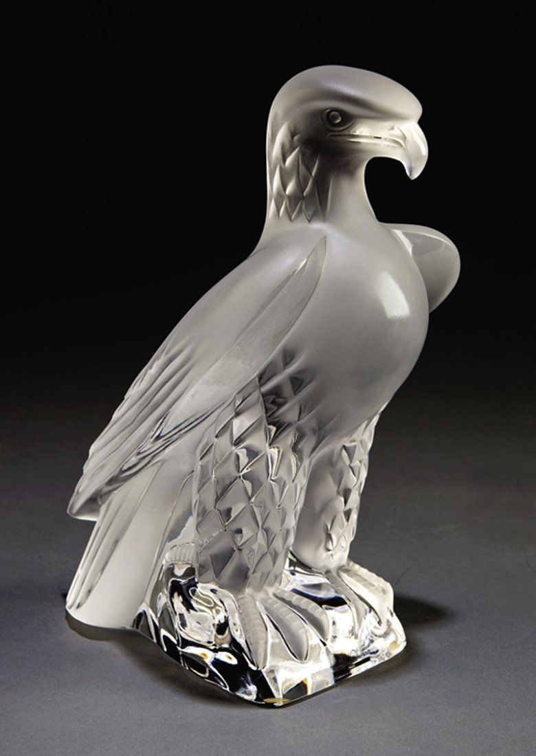A Lalique Glass "Liberté" Figure: A Lalique Molded Clear and Frosted Glass "Liberté" Figure, 20th c., after a 1975 design by Marc Lalique of an eagle standing on a rockwork base, base etched "Lalique France", height 9 1/4 in