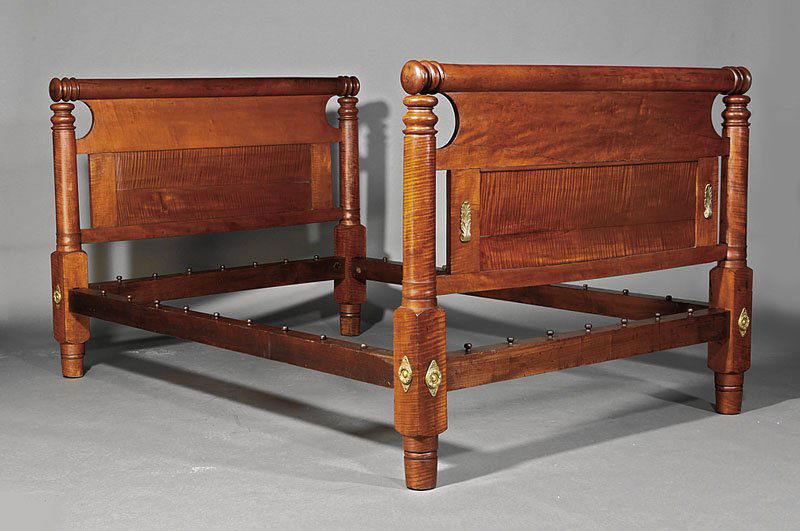 An American Classical Tiger Maple Bedstead: An American Classical Tiger Maple and Cherrywood Bedstead, c. 1830, cylindrical crest rails, paneled headboard, turned posts, pegged rails, turned feet, height 42 1/2 in., interior length 73 in., widt