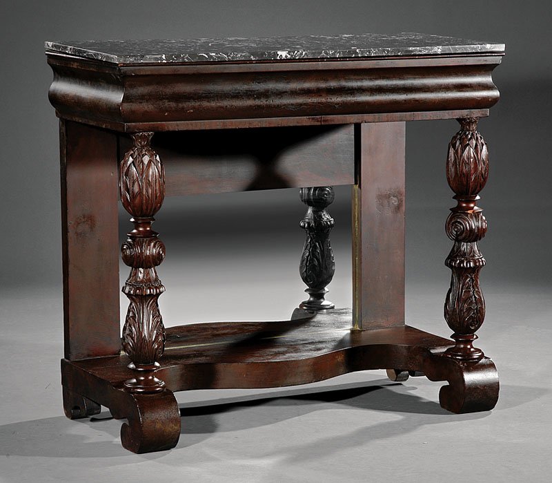 An American Carved Mahogany Pier Table: An American Carved Mahogany Pier Table, 19th c., marble top, molded frieze, pineapple carved supports, mirrored back, incurvate plinth, scroll feet, height 36 7/8 in., width 41 in., depth 18 1/8 in