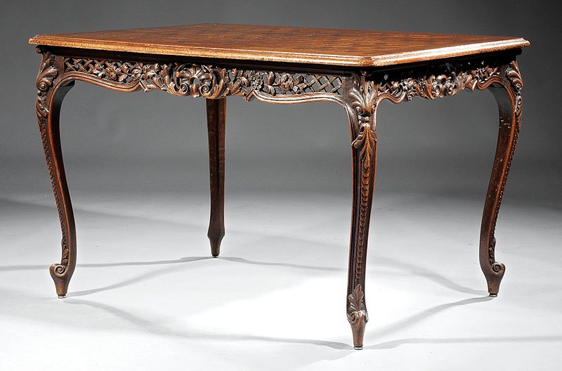 A Louis XV-Style Oak Parquetry Dining Table: A Louis XV-Style Carved Oak Parquetry Dining Table, banded top, foliate pierced frieze, acanthine cabriole legs, scrolled toes, height 31 in., width 47 in., depth 37 in