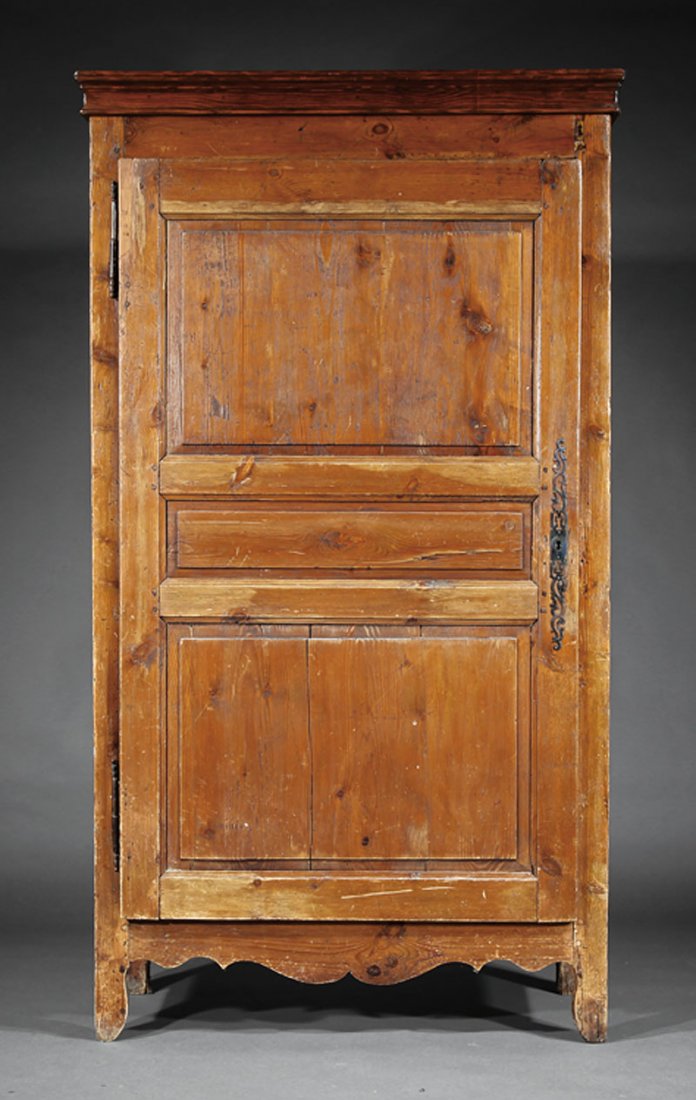 An American Carved Pine Single Door Armoire: An American Carved Pine Single Door Armoire, 19th c., molded cornice, paneled door, peg construction, shaped legs, height 79 1/2 in., width 44 1/2 in., depth 19 1/4 in