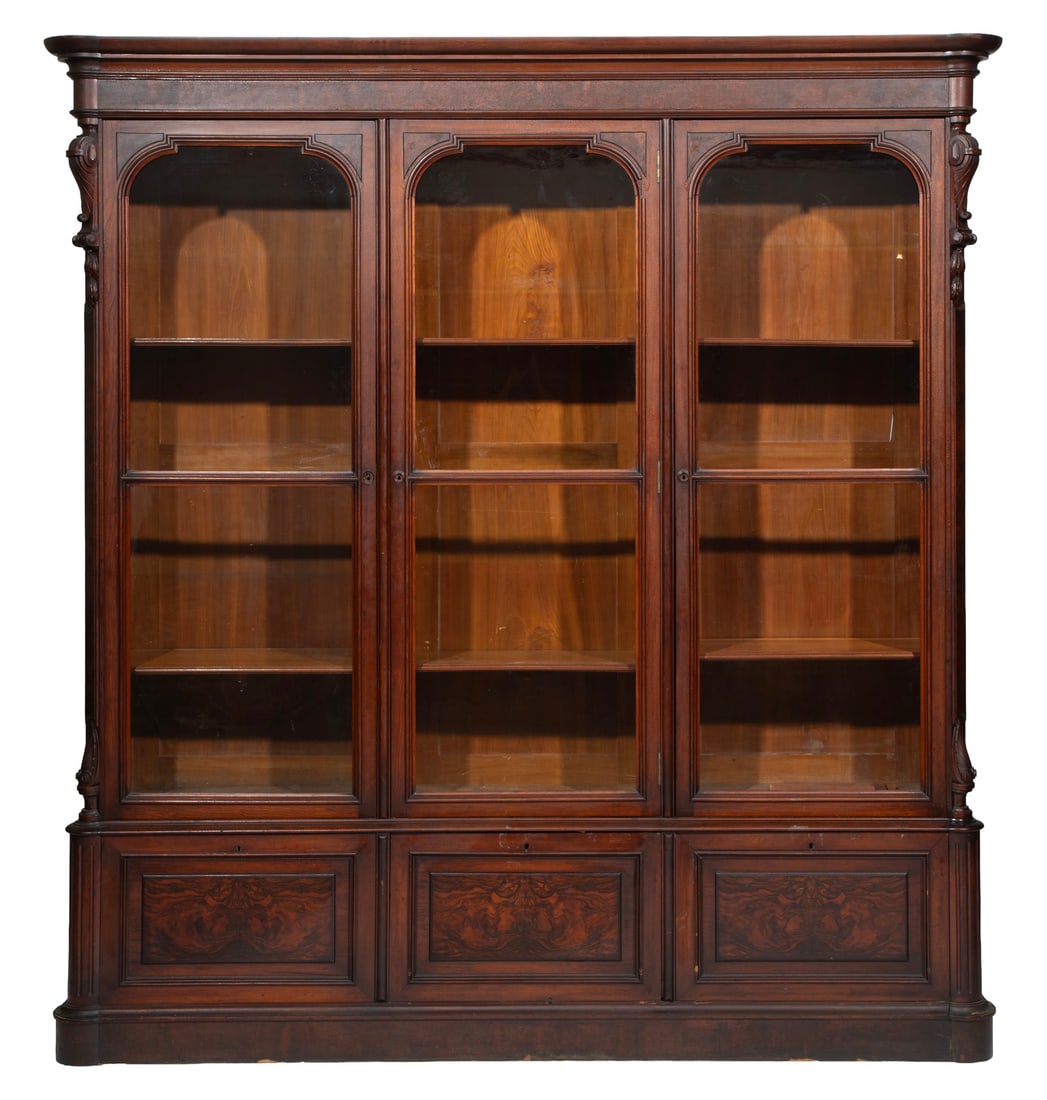 American Renaissance Revival Burl Walnut Bookcase: American Renaissance Revival Burl Walnut Bookcase19th c., molded cornice, glazed doors, base with three fall-front molded paneled doors, plinth base96 x 86 1/2 x 17 1/2 in. (243.8 x 219.7 x 44.5 cm.)