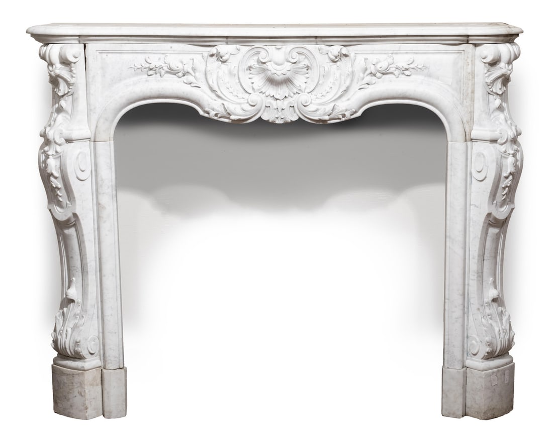 Louis XVI-Style Marble Mantel: Louis XVI-Style Marble Mantelshaped top, scroll and foliate pilasters, h. 45 in., w. 56 in., d. 18 in., opening h. 35 in., w. 38 in.45 x 56 x 18 in. (114.3 x 142.2 x 45.7 cm.) Ida Manheim Antiques, 40