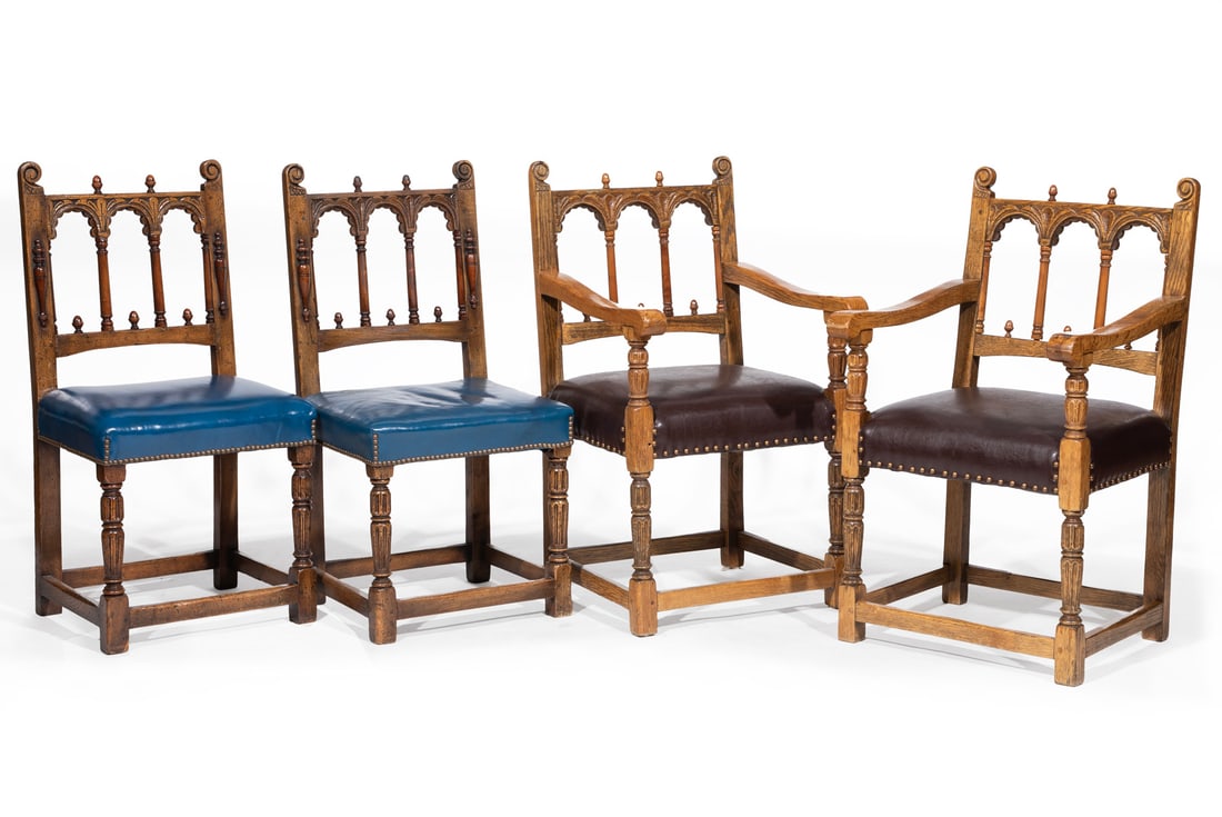 Suite of Four Tudor-Style Carved Oak Chairs: Suite of Four Tudor-Style Carved Oak Chairs19th and later c., arched spindled back, fluted carved supports, stretcher block legsProvenance: Estate of Mr. & Mrs. Jacob Cohen, Manheim Galleries, New Orl