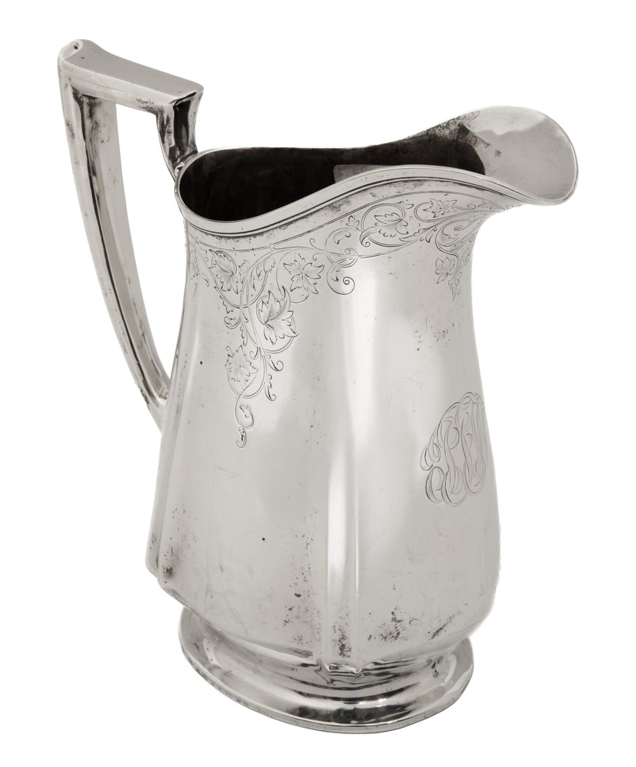 American Sterling Silver Water Pitcher: American Sterling Silver Water Pitcher,trademark rubbed, 1st half of 20th c., footed form with angular handle, foliate scroll flat chasing, engraved script monogram.Provenance: Estate of Elizabeth Lem
