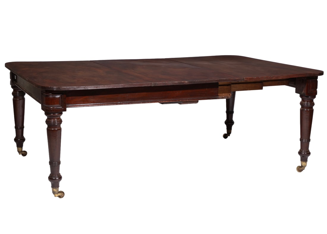 William IV Carved Mahogany Extension Dining Table: William IV Carved Mahogany Extension Dining Tableearly 19th c., attr. to Gillows of Lancaster, after a design by Thomas King, reeded top, molded frieze with tablet corners, turned tapered legs, caster