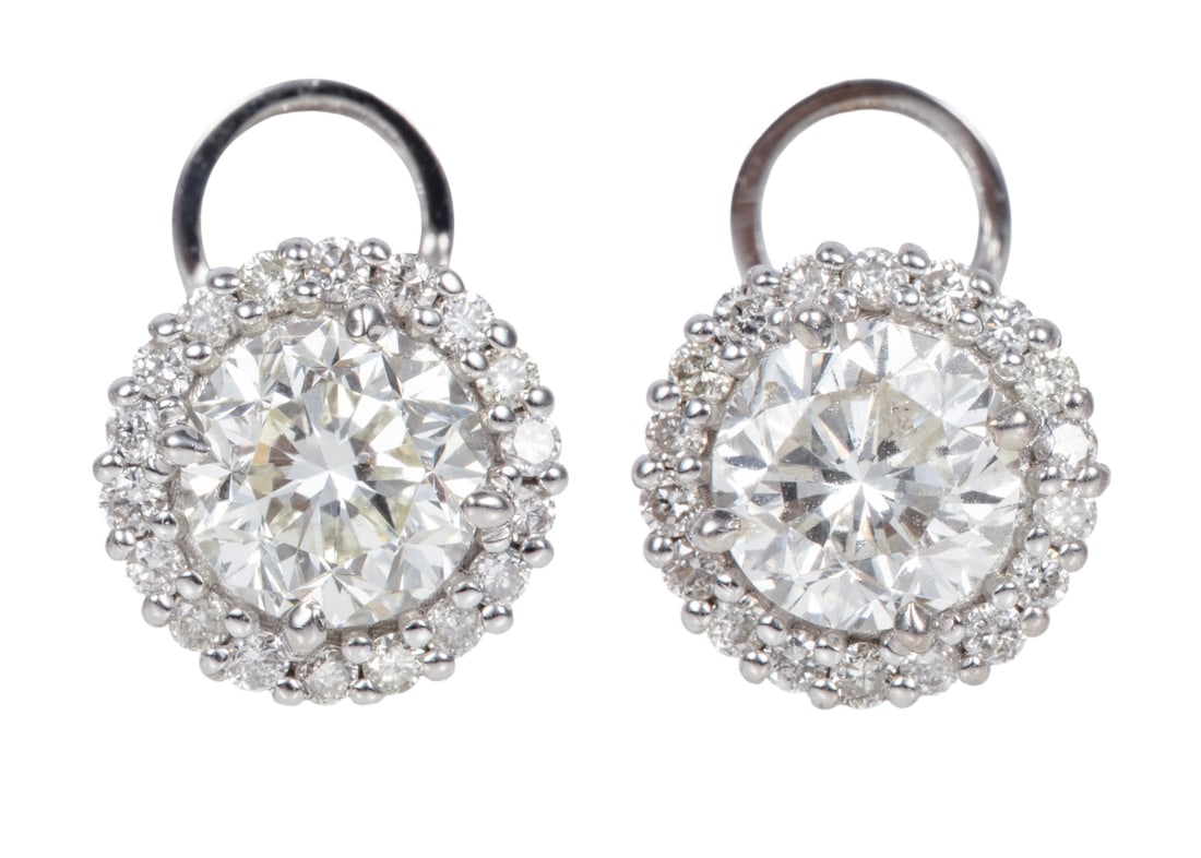 Pair of 18 kt. White Gold and Diamond Stud Earrings: Pair of 18 kt. White Gold and Diamond Stud Earrings2 center round diamonds, total wt. approx. 2.00 cts.; bezels with numerous round diamonds, total wt. approx. 0.38 ct.; 2.50 dwts.Please Note: Payment