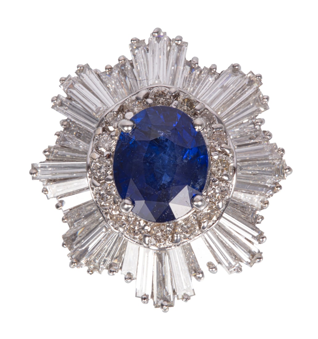 18 kt. White Gold, Sapphire and Diamond Ring: 18 kt. White Gold, Sapphire and Diamond Ringcenter oval mixed cut Sri Lankaan sapphire, wt. approx. 5.20 cts.; ballerina bee with 56 round and baguette diamonds, total wt. approx. 5.50 cts., F-G color